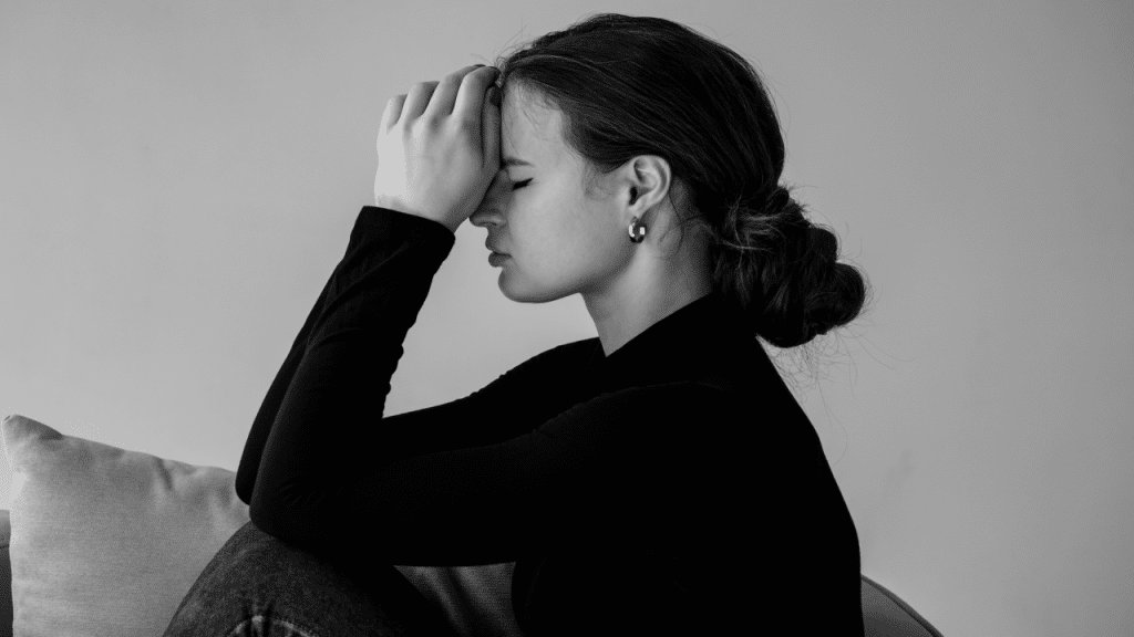 A woman looking upset at home
