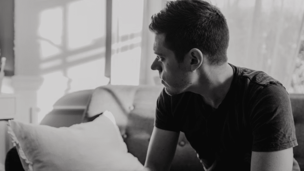 A man deep in thought at home