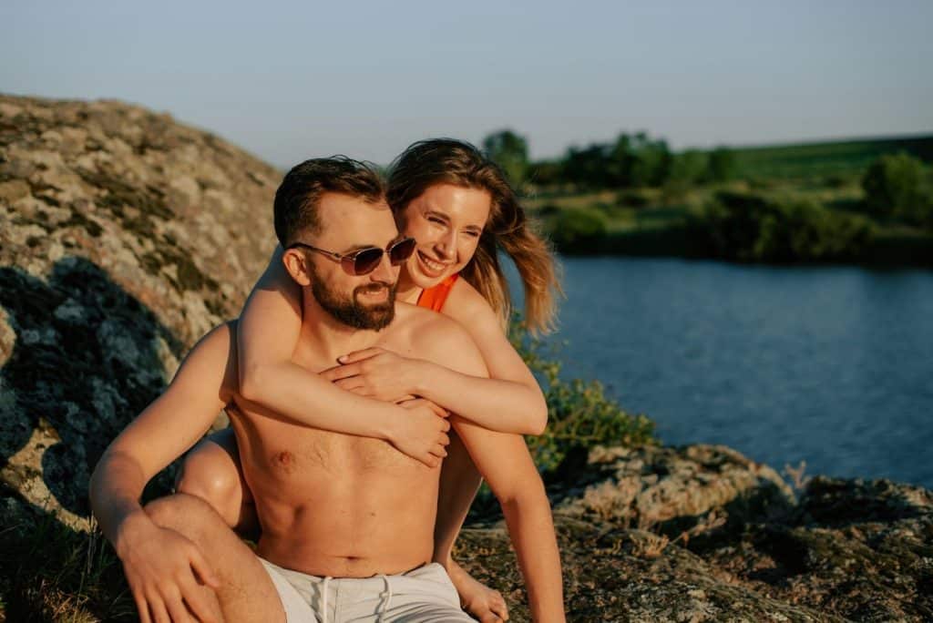 A woman hugging a man