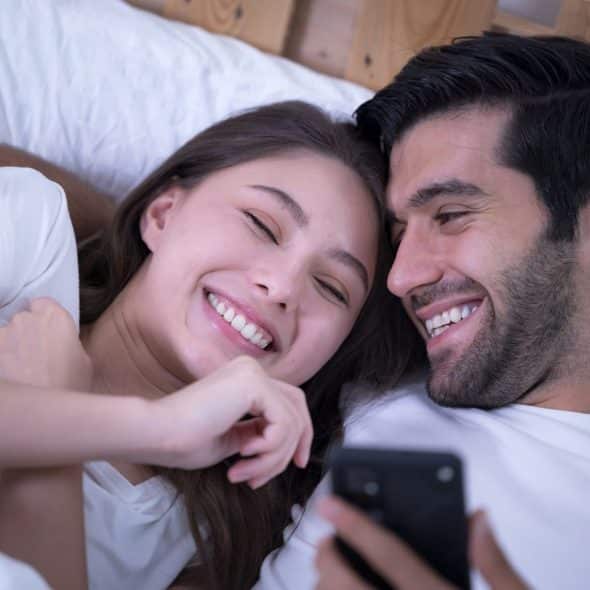 A man showing something to woman