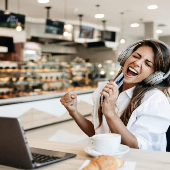 A happy woman at a bakery