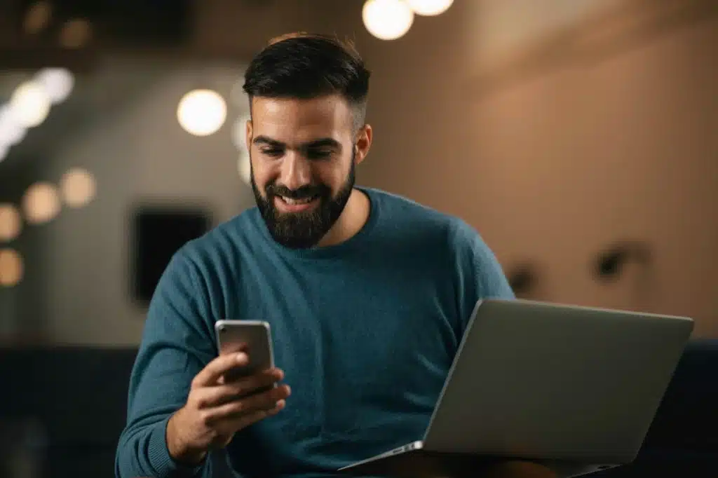 A man thinking while using a phone