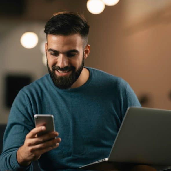 A man thinking while using a phone