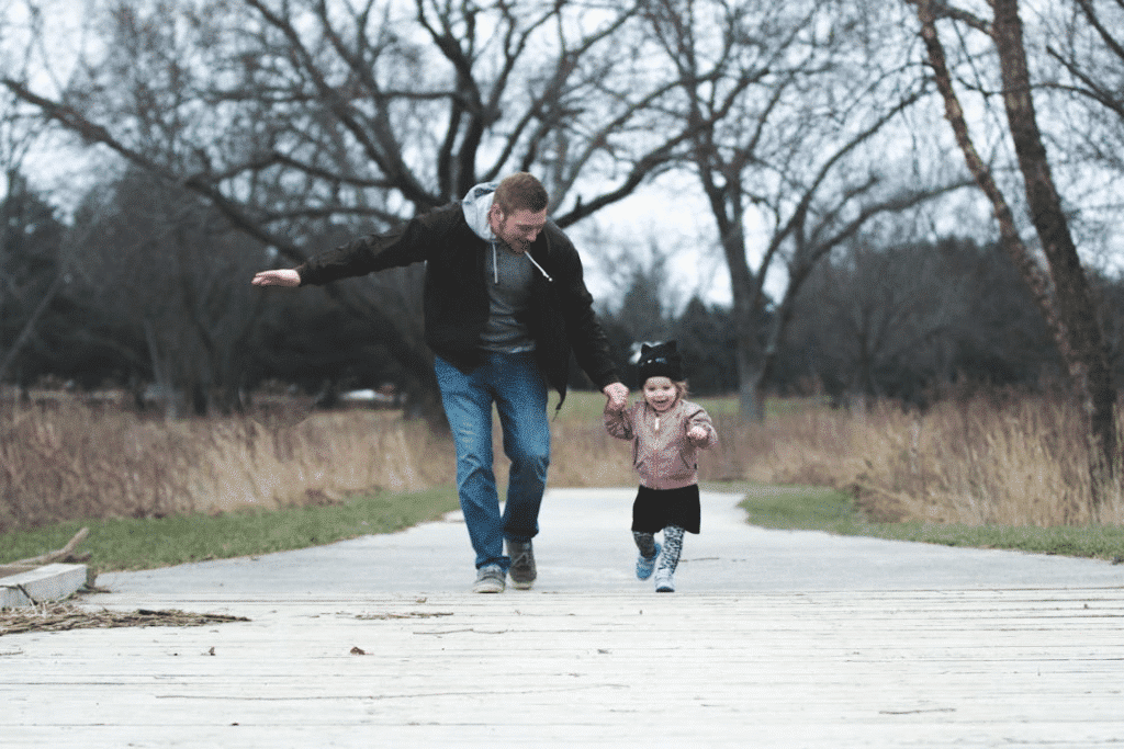 A man playing with his daughter