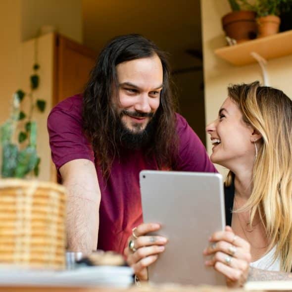 A man smiling at the woman