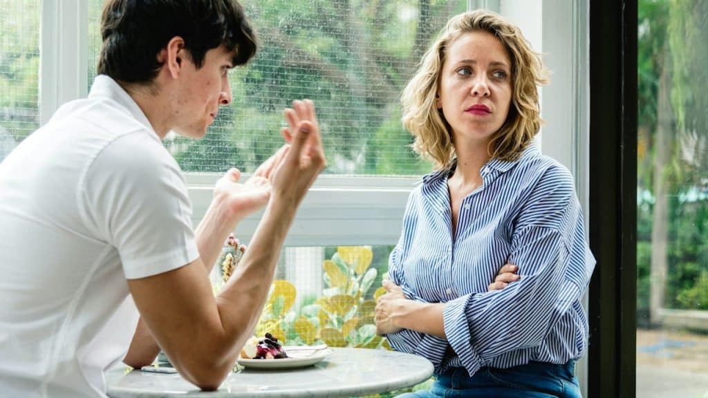 A couple having argument at the cafe.