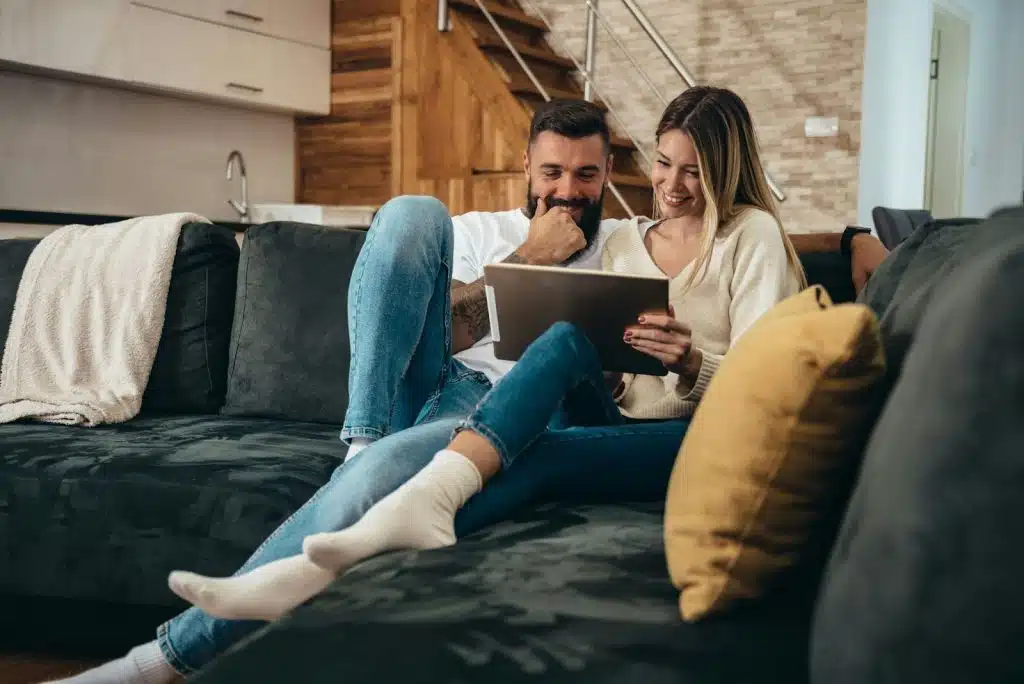 A man and woman at the couch