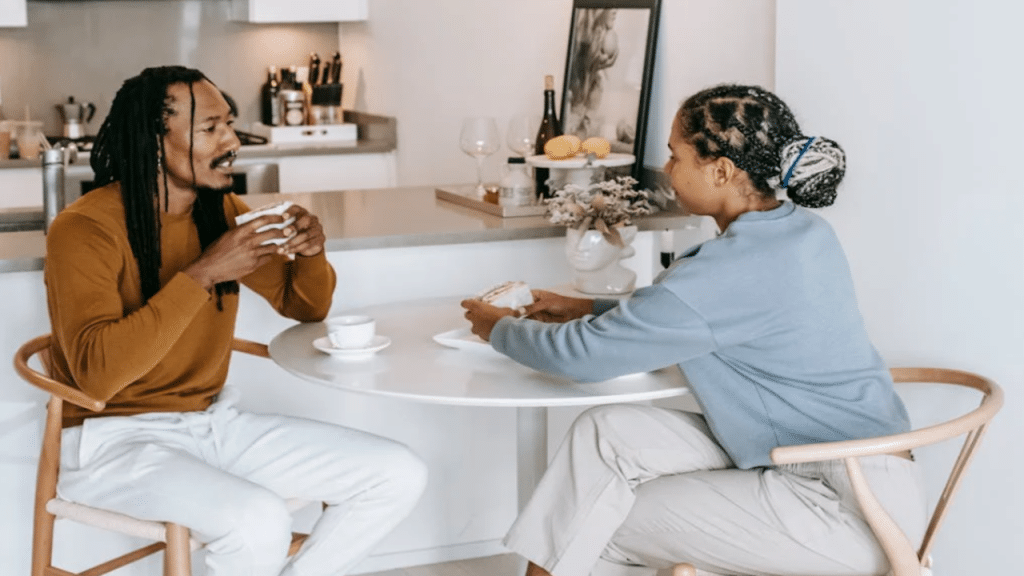 A couple talking in the kitchen