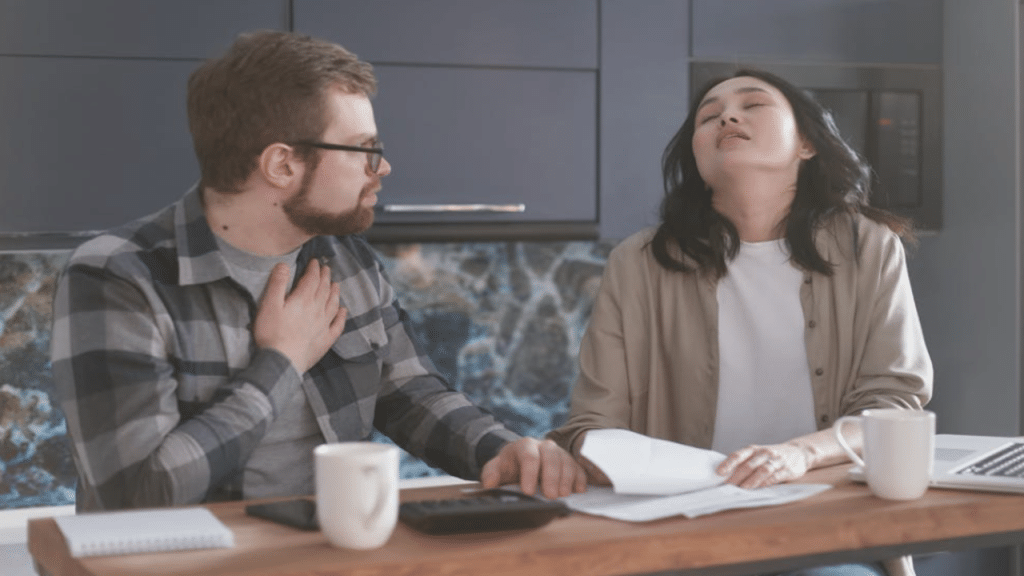 A couple looking stressed about the bills