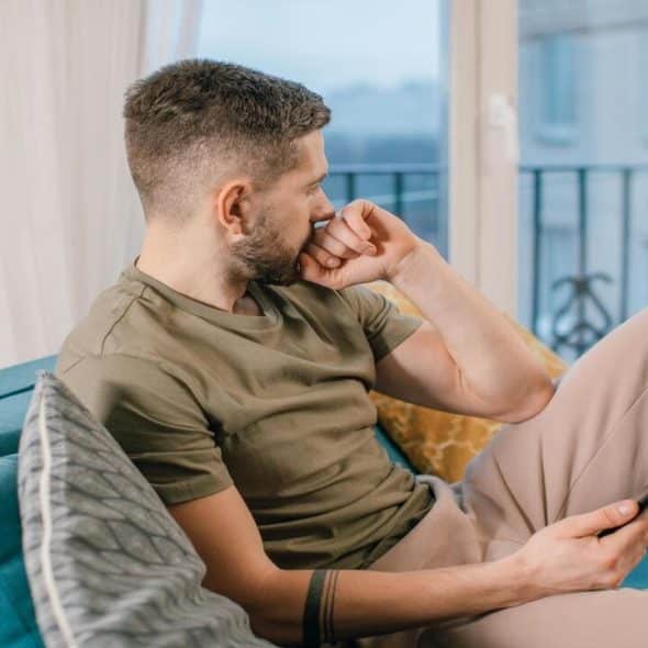A man looking upset at home