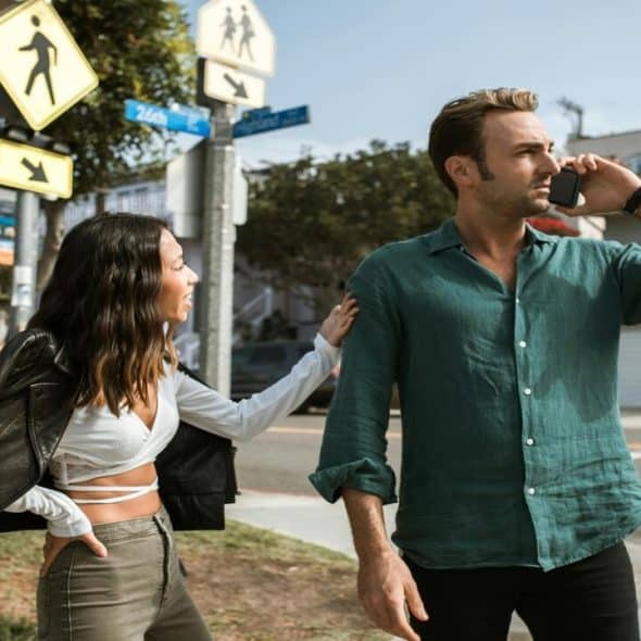 A couple arguing outdoors