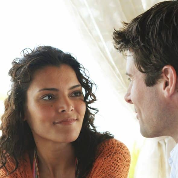 A man and a woman looking at each other.