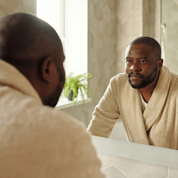 A man wearing a bathrobe