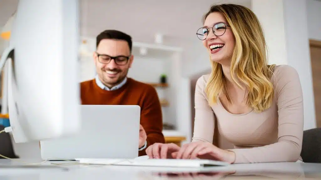 A man and a woman talking and chatting at work