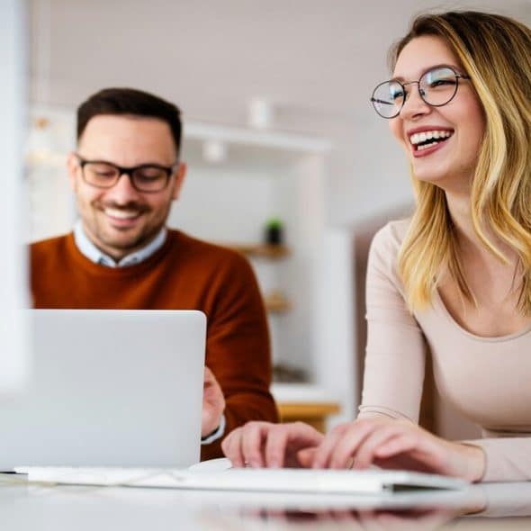 A man and a woman talking and chatting at work