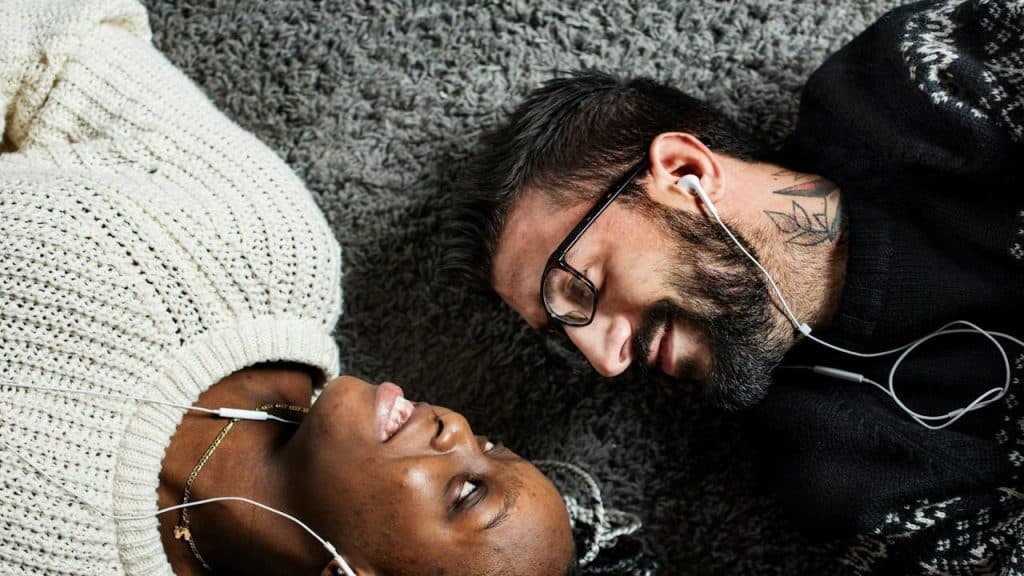 A couple listening to music together.