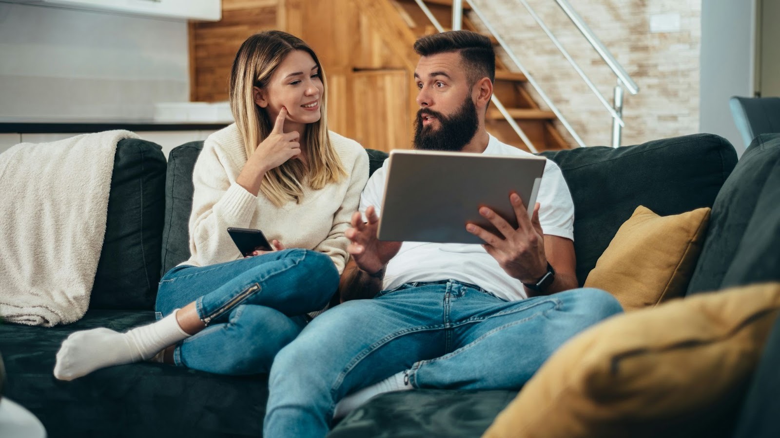 A man and woman at the couch
