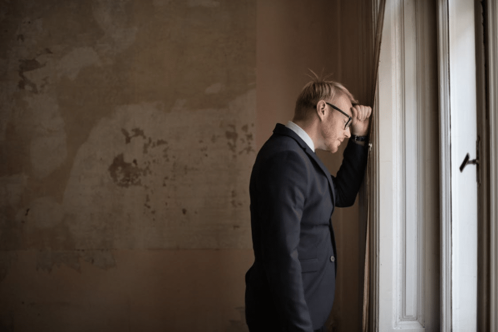 A man leaning on the wall