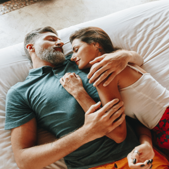 A mature couple relaxing in a hotel room