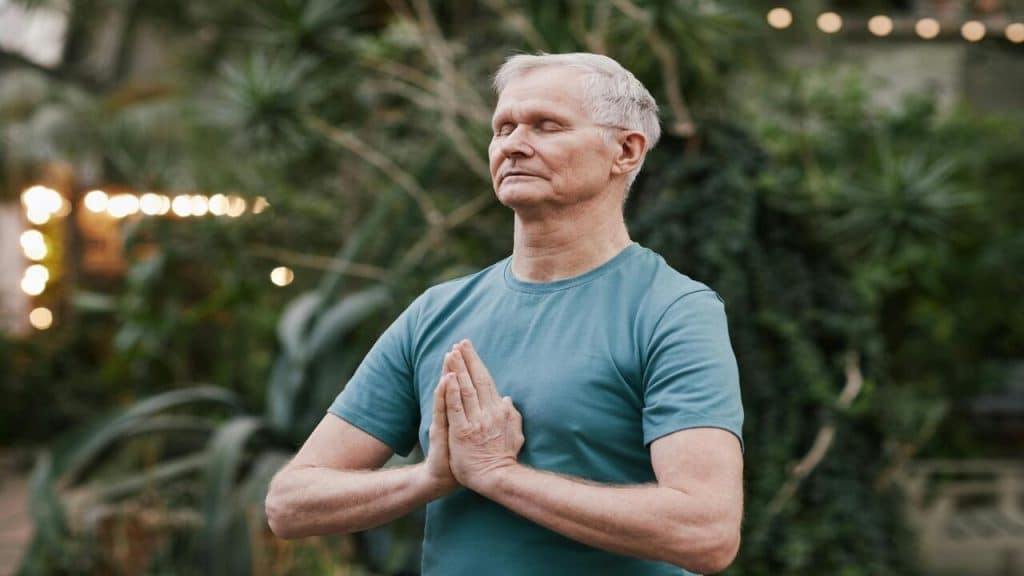 A man practicing yoga