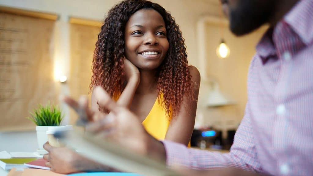 A woman smiling attentively