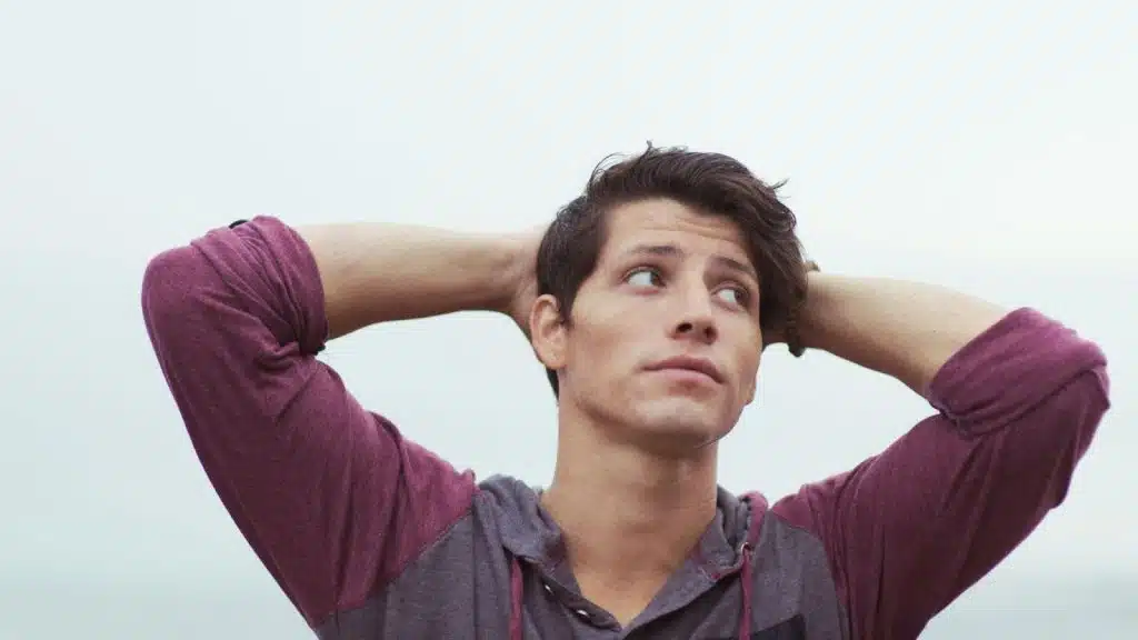 A man holding his head