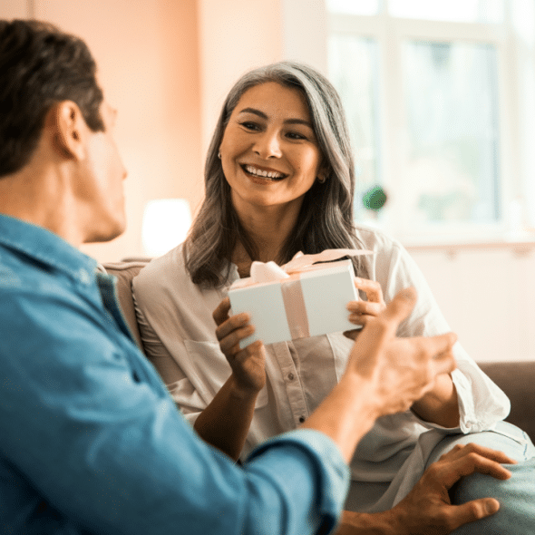 A wife receiving a gift from her husband