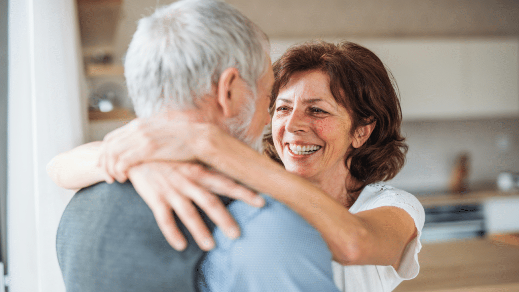 A mature couple hugging after a fight