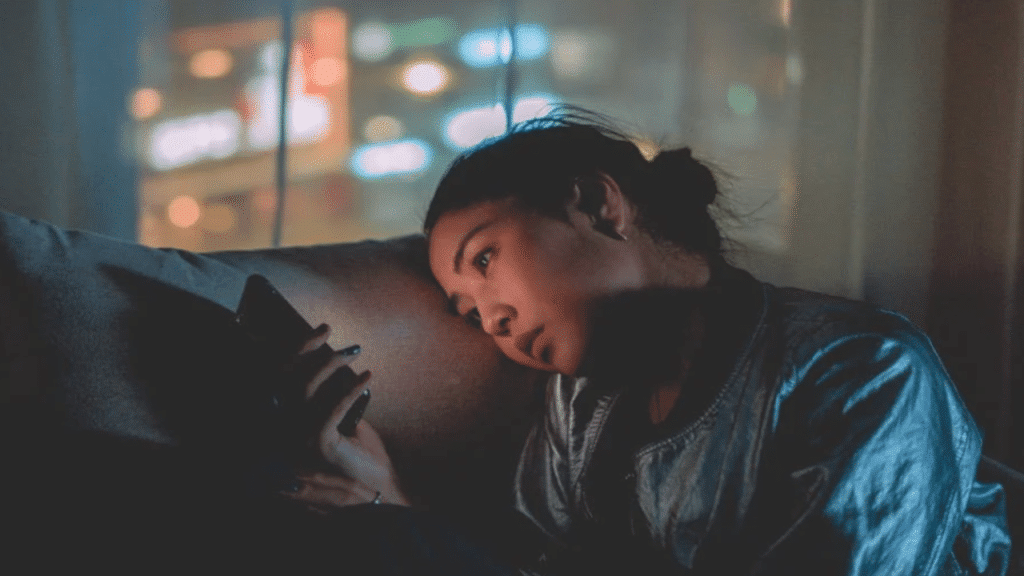 A woman waiting for a text