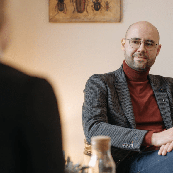A man listening to a woman