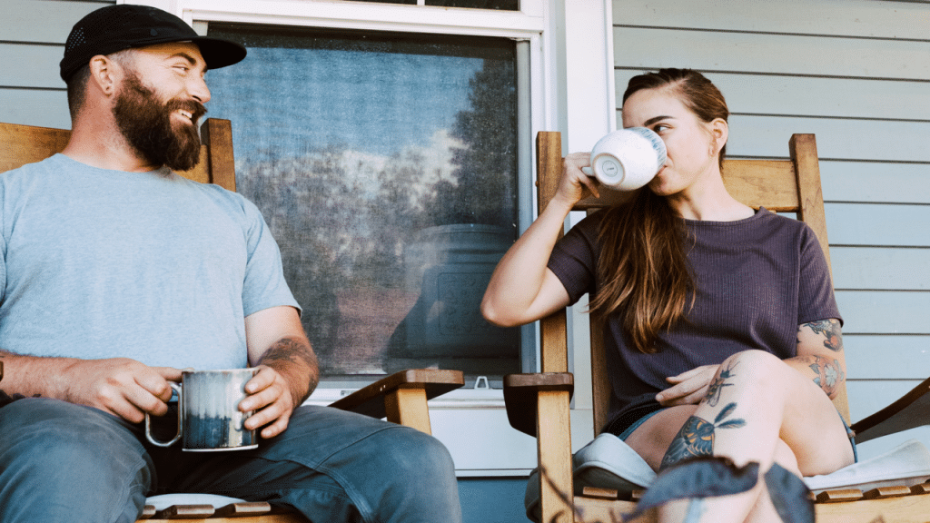 A couple talking on the porch