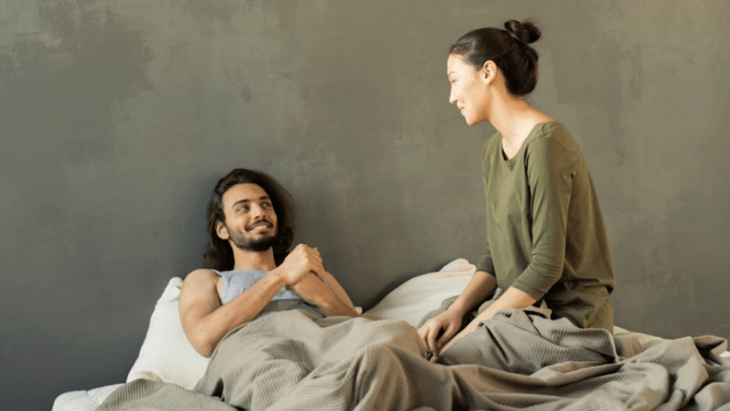 A couple talking in bed