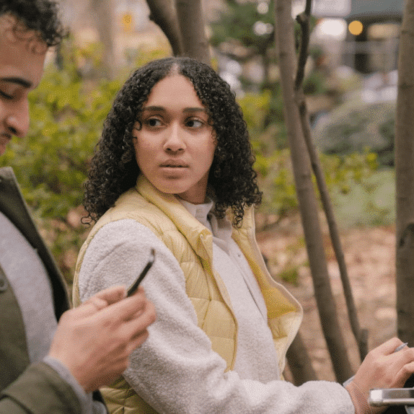 A woman looking at the man