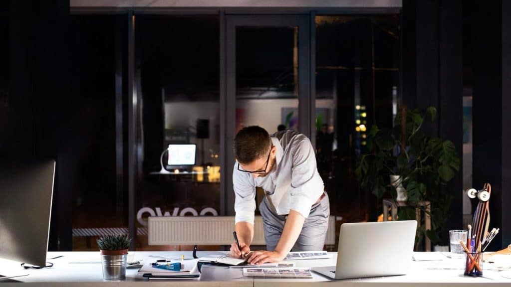 A man working late at his desk.