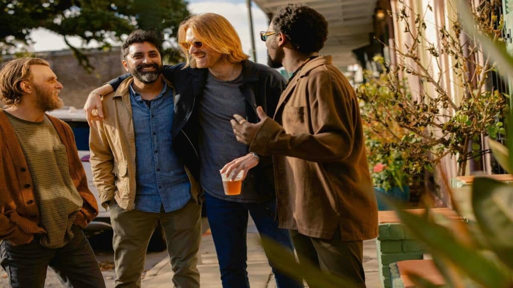 Male friends having beer together