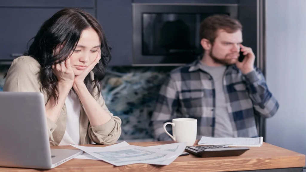 A couple busy with their bills