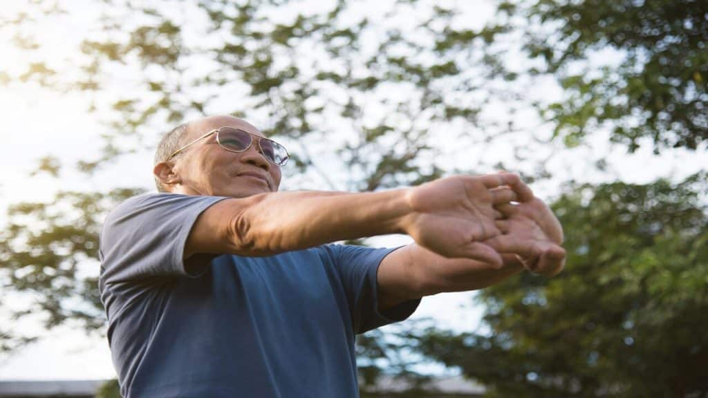 A man stretching outdoors