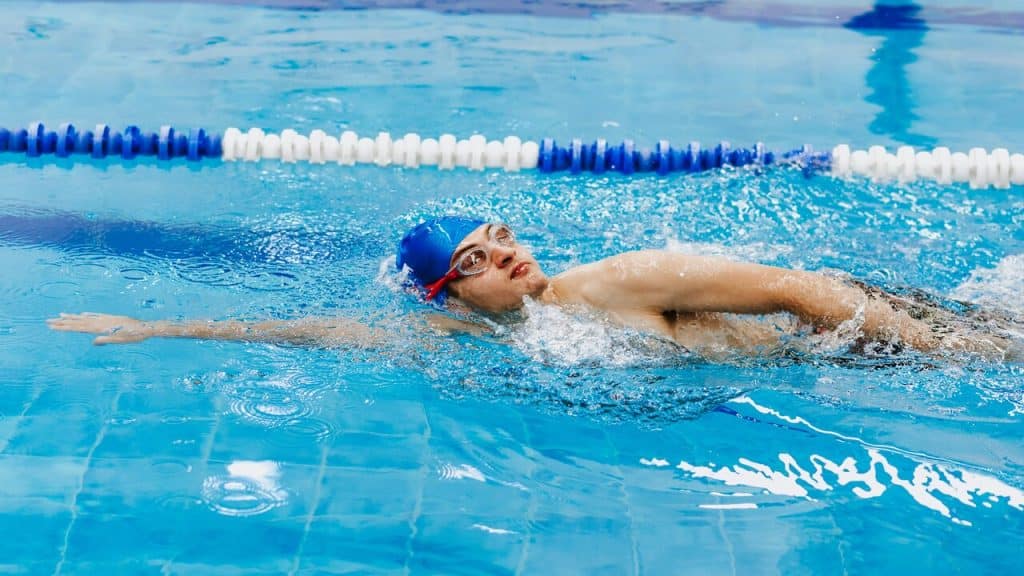 A man swimming in a pool