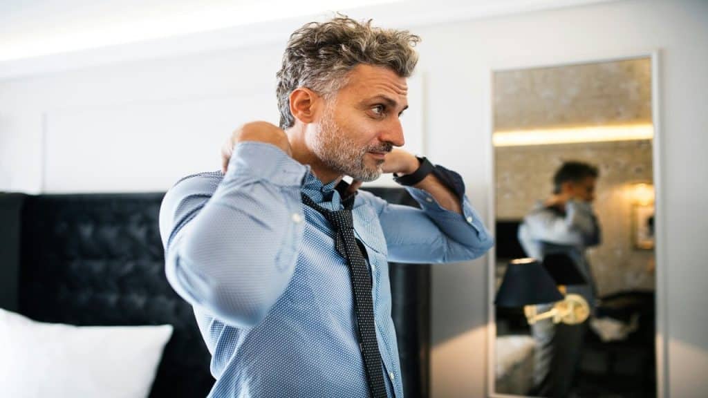 A mature man in a luxurious room