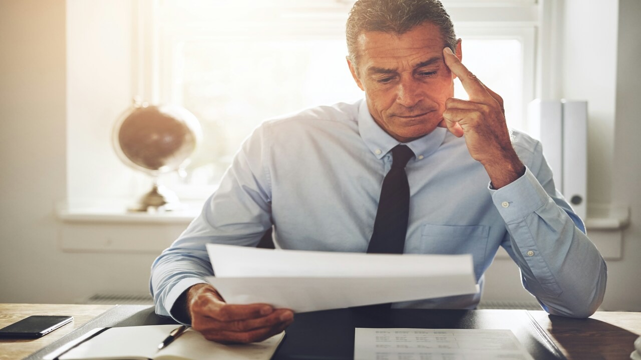 A CEO reviewing documents