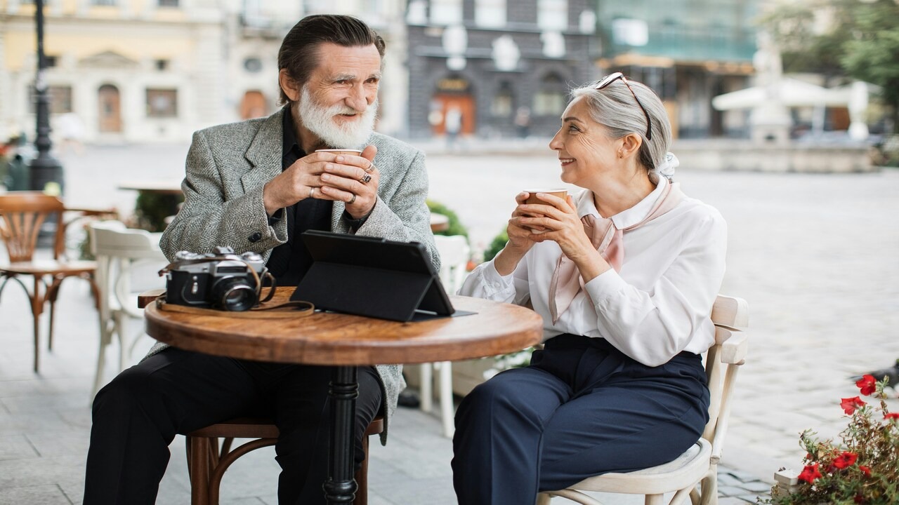 A mature couple laughing together