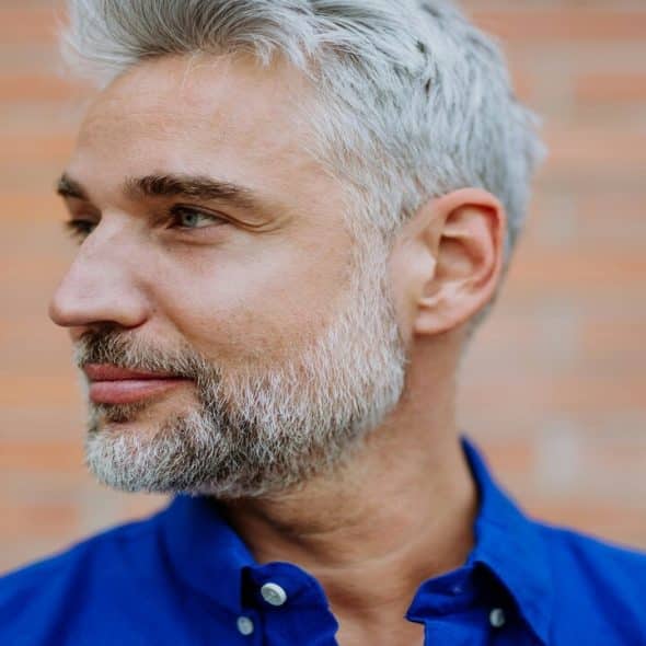 A mature man looking away
