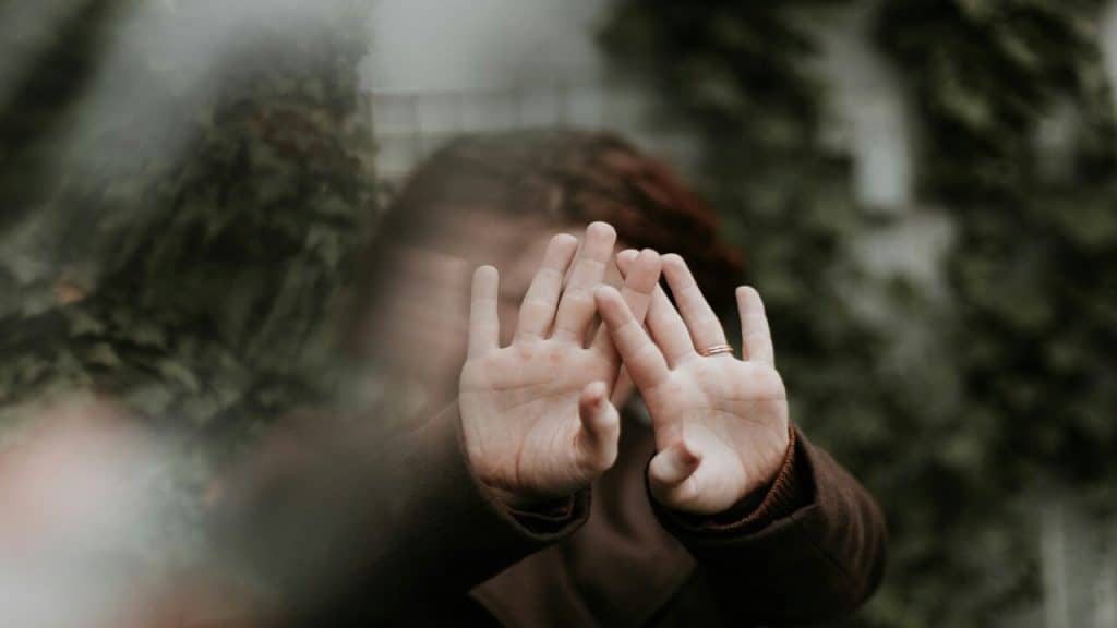 A woman saying no with her hands