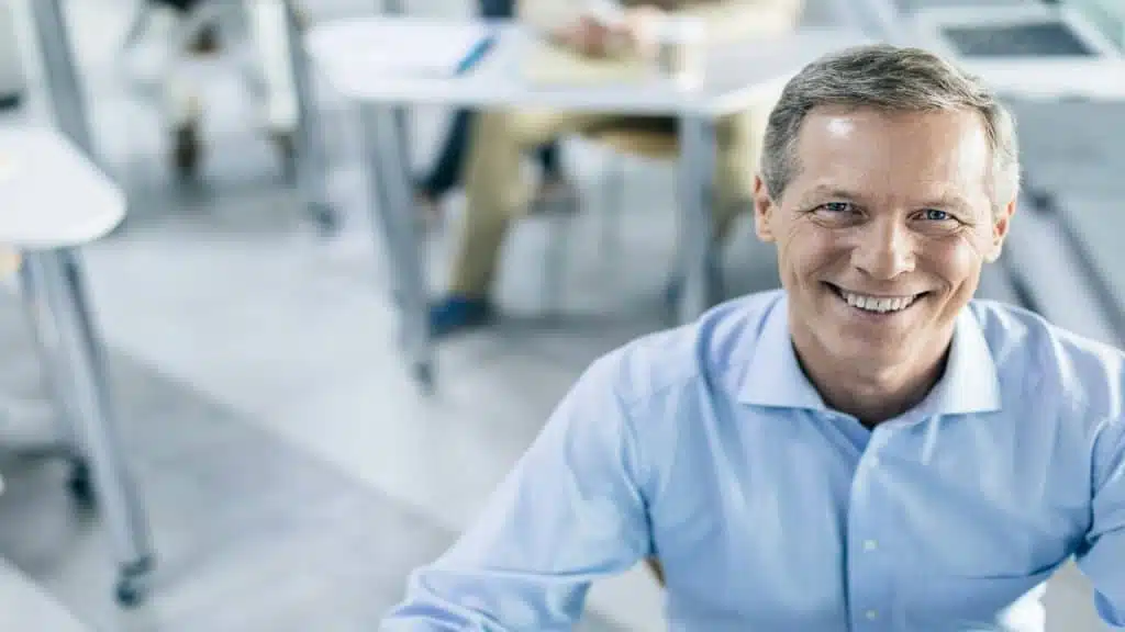 A man smiling at the office