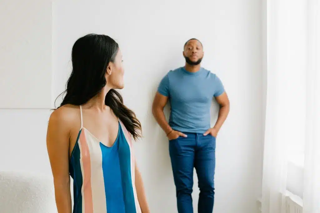 A woman looking back at the man