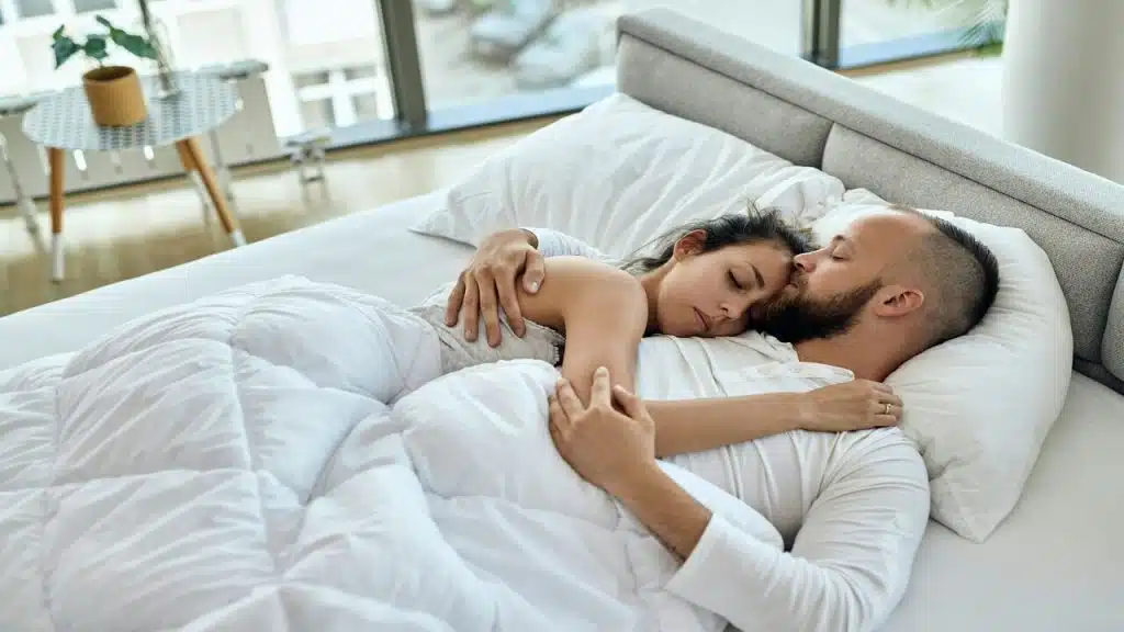 Young couple sleeping in bed