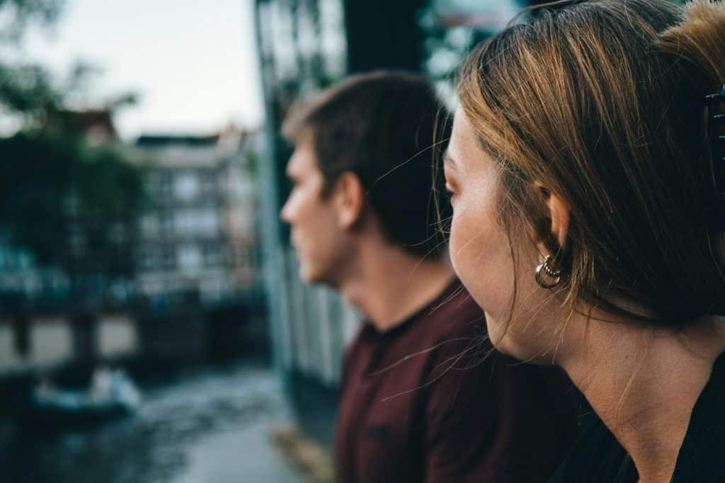A woman looking at the man
