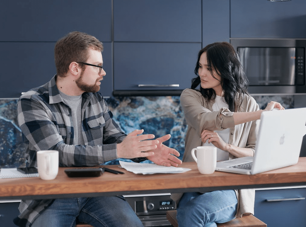 A man explaining to a woman