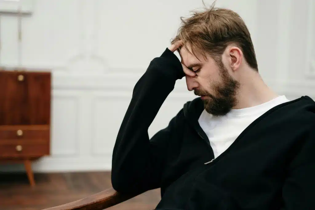 A man looking tired and frustrated