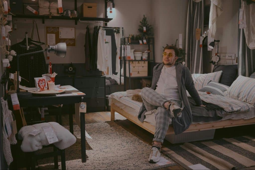 A man sitting on the bed